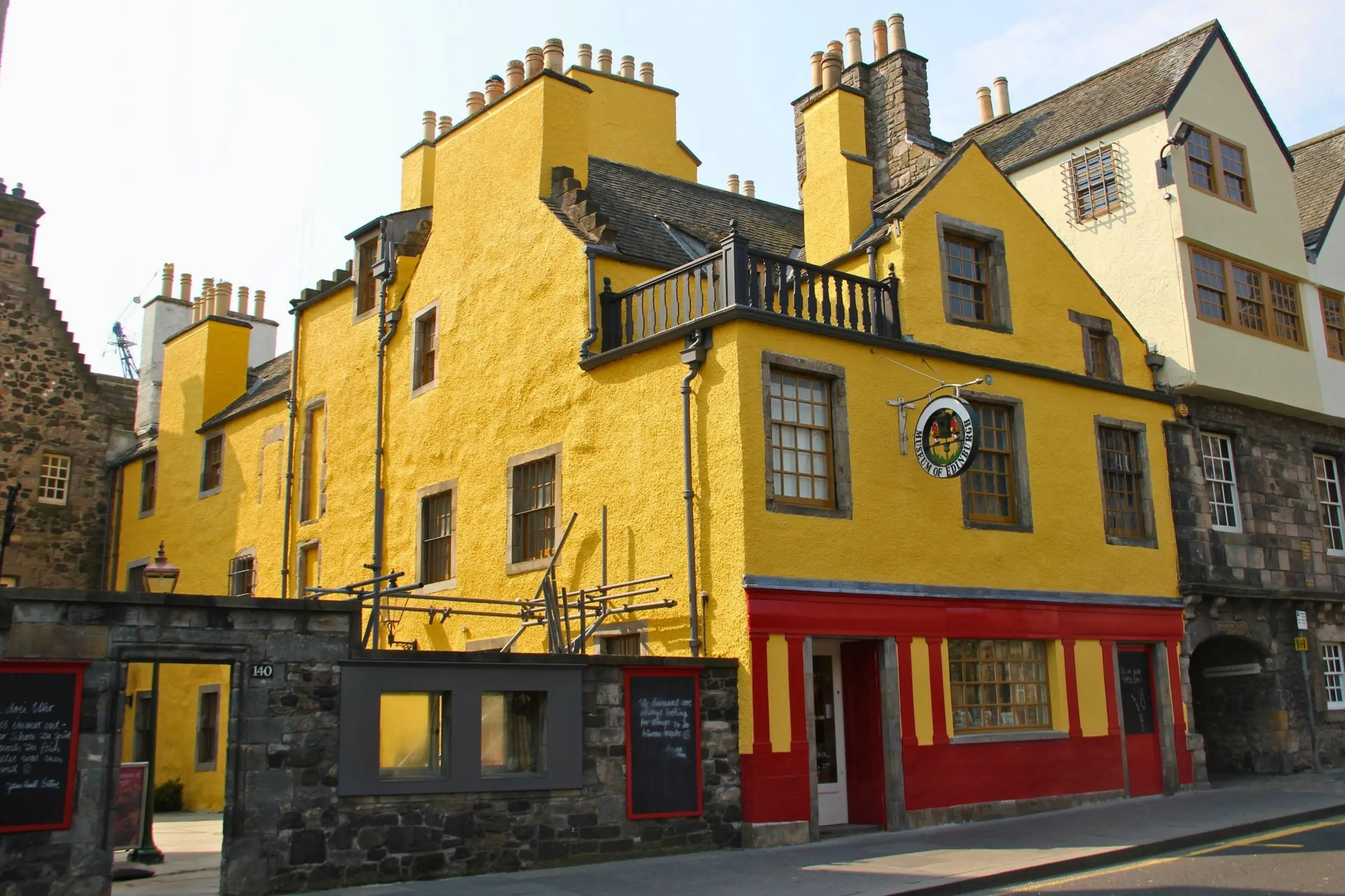 The bright yellow exterior of Huntly House, home to the Museum of Edinburgh on the Royal Mile